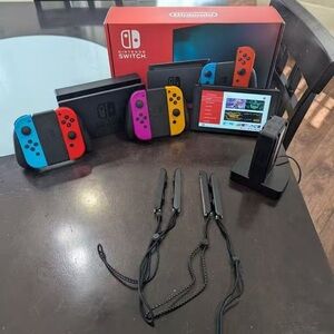 Nintendo Switch with Red, Blue, Pink & Yellow Joy-Con Set